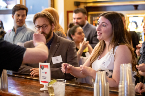 Community members talk at an event.