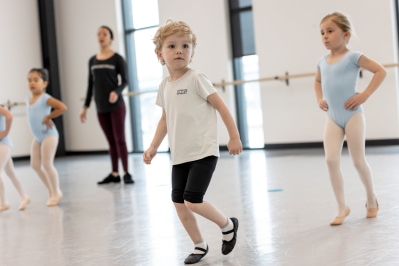 group of children practicing ballet in the studio